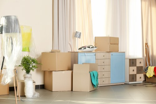 Packing boxes and wrapping household items for a move in Dulwich