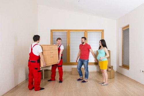 Organised moving team loading household items for transport in Dulwich