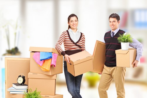 Local moving team handling boxes in a Dulwich street