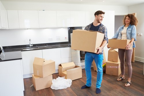 Professional movers loading furniture for transport in Dulwich