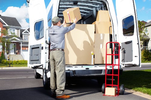 Movers handling desks and office furniture with care