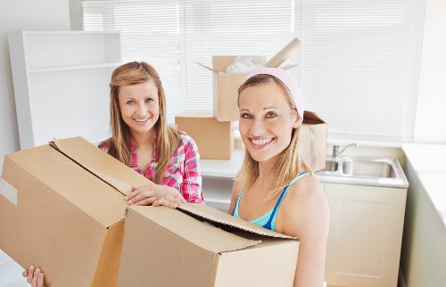 Unpacking kitchen and household items in a Dulwich property after moving